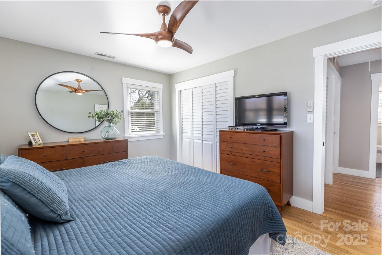 29 Willowbrook Road, Unit 11 Asheville, NC 28805 - Photo 29 of 46 a bedroom with a bed mirror on desk and a window