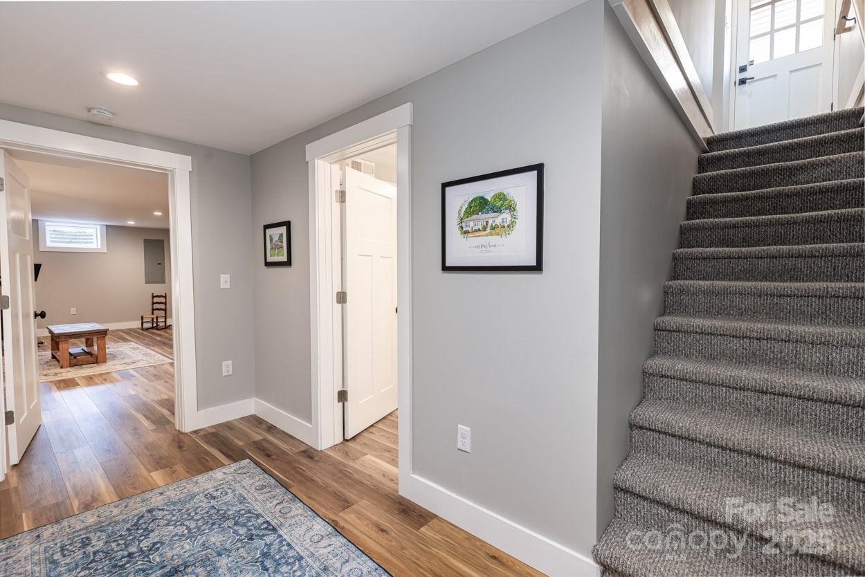 29 Willowbrook Road, Unit 11 Asheville, NC 28805 - Photo 33 of 46 a view of a hallway with wooden floor and a living room