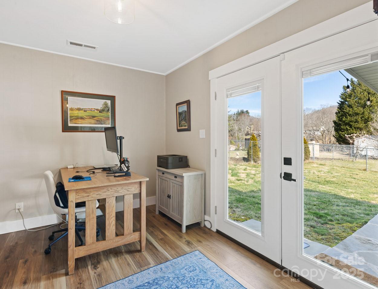 29 Willowbrook Road, Unit 11 Asheville, NC 28805 - Photo 34 of 46 a view of a bedroom with furniture window and wooden floor