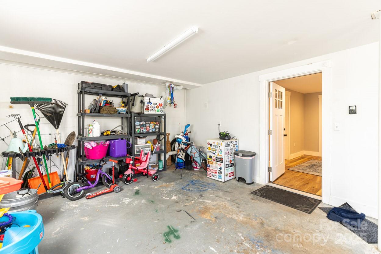 29 Willowbrook Road, Unit 11 Asheville, NC 28805 - Photo 41 of 46 a view of a garage with rack and bicycle