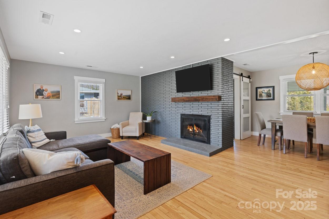 29 Willowbrook Road, Unit 11 Asheville, NC 28805 - Photo 10 of 46 a living room with furniture and a fireplace
