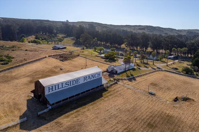 a view of a backyard with sitting area