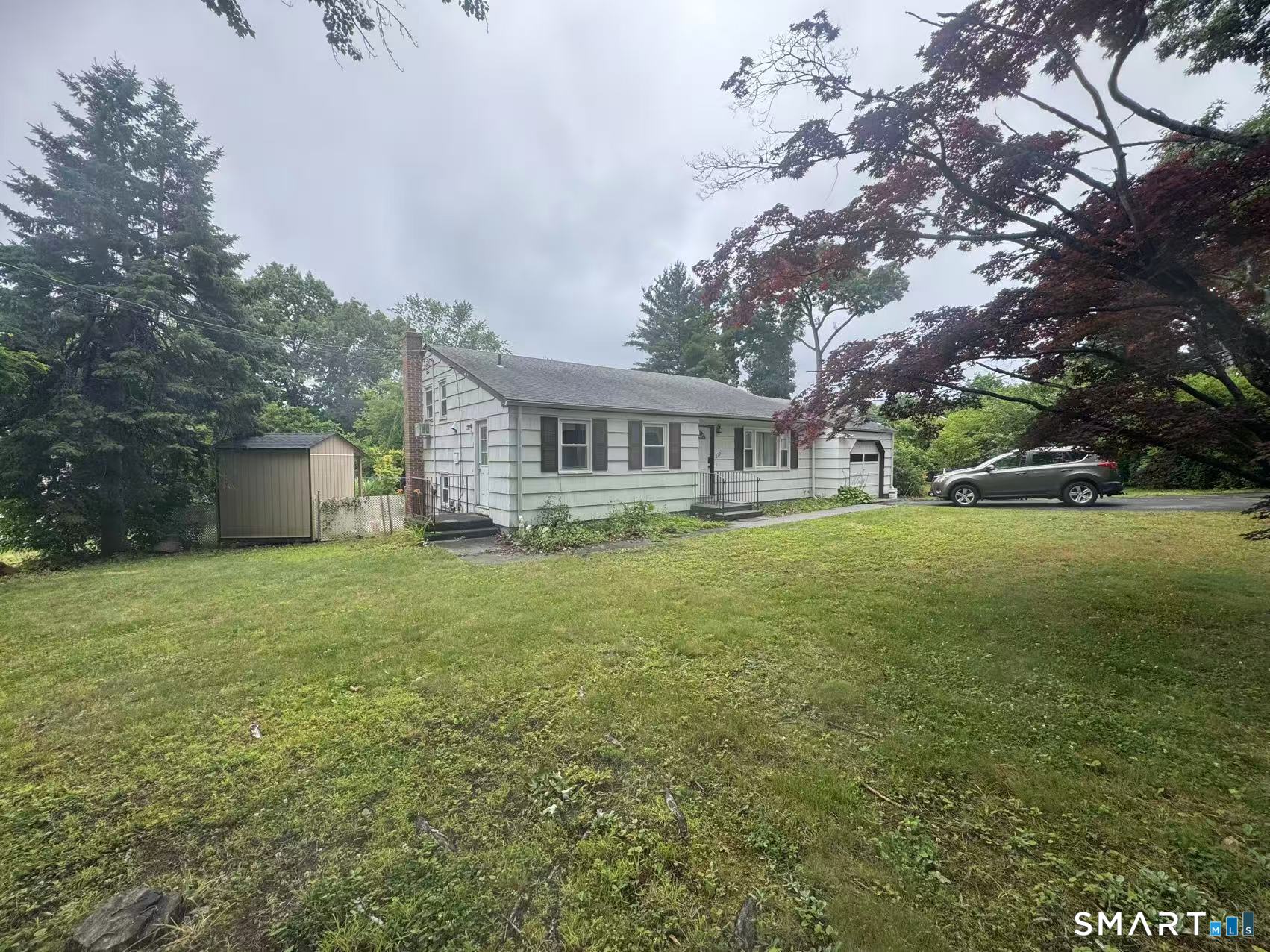 1122 Fienemann Road Farmington, CT 06032 - Photo 2 of 26 a house view with a garden space