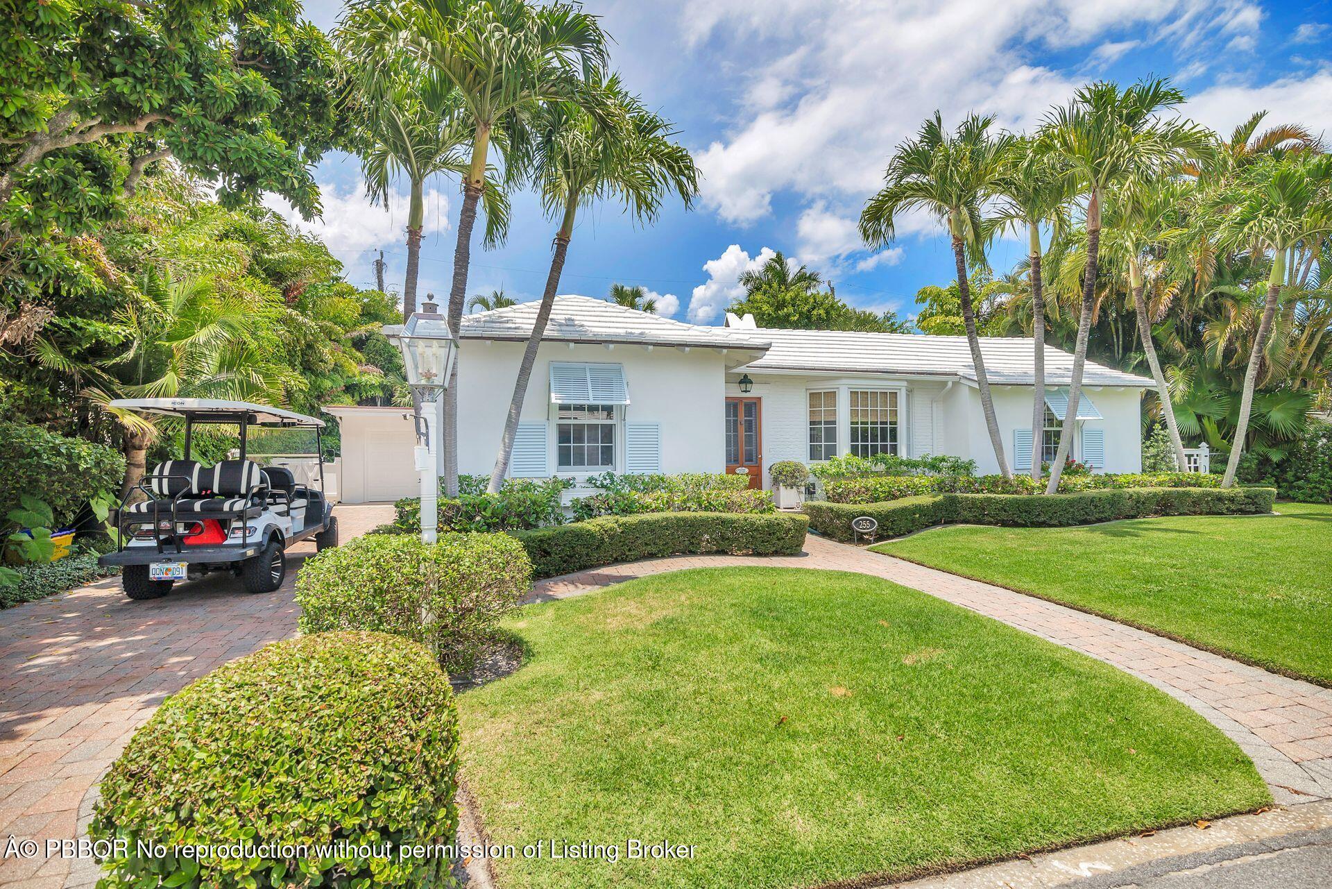 255 Colonial Lane Palm Beach, FL 33480 - Photo 2 of 32 front view of a house with a garden