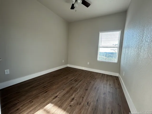 a bathroom with a tub sink and vanity