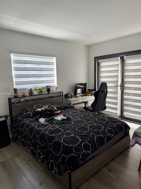 8950 Southwest 197th Street Cutler Bay, FL 33157 - Photo 12 of 15 a bed sitting in a bedroom next to a window