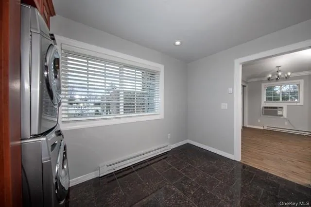 a view of a room with wooden floor and windows