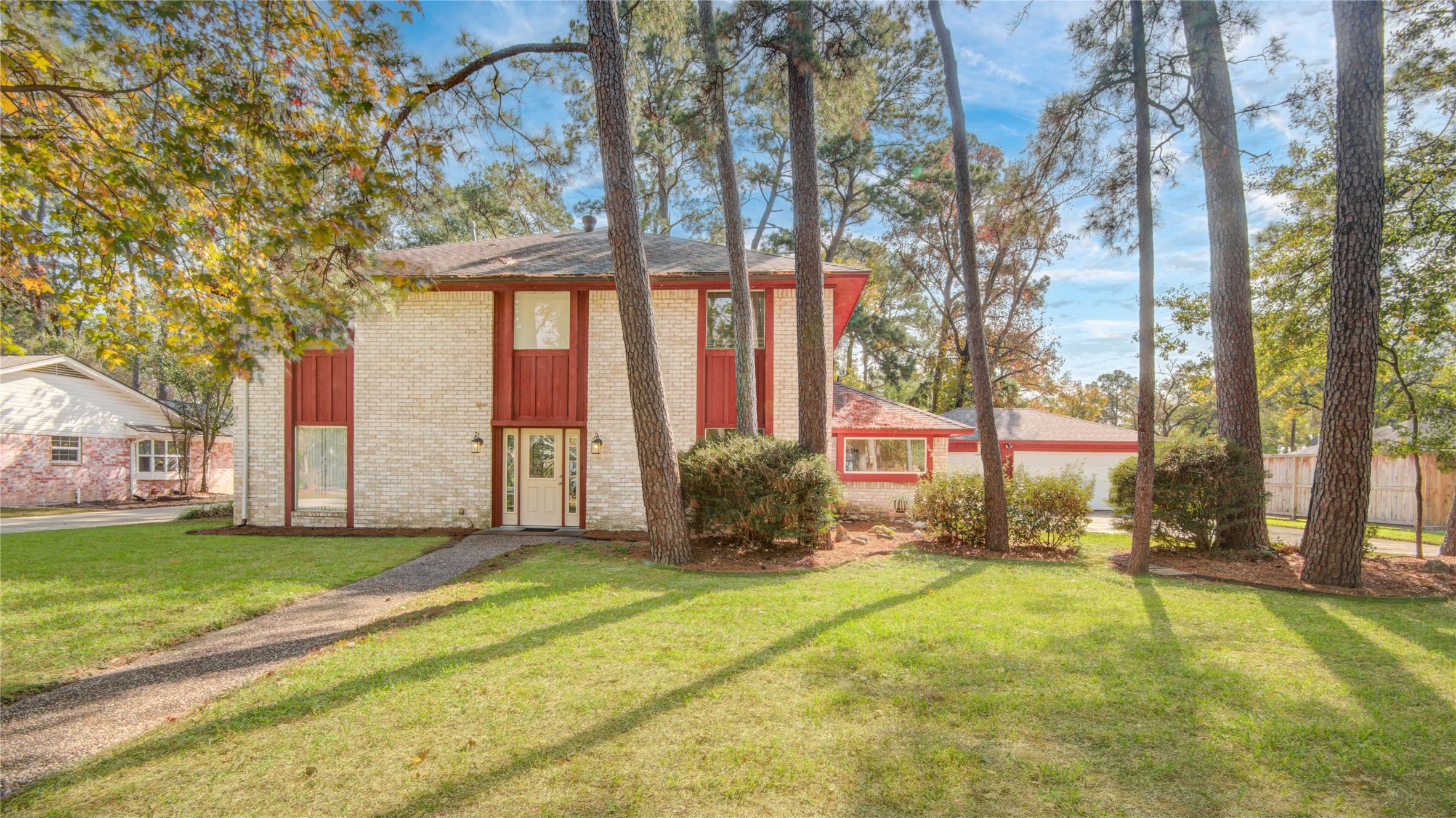 a view of a backyard with large tree