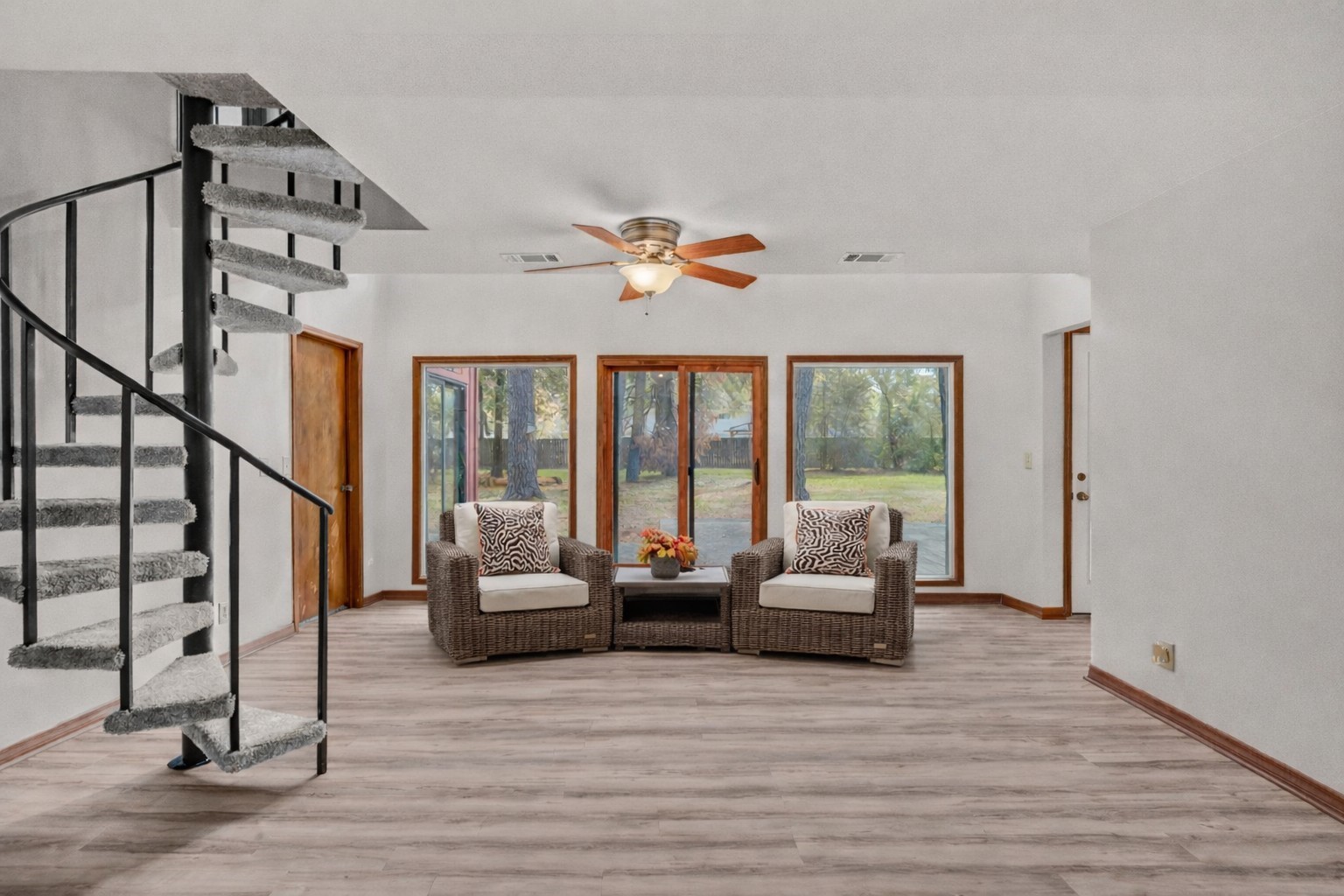 6711 River Lodge Drive Spring, TX 77379 - Photo 14 of 39 a living room with furniture large windows and a chandelier