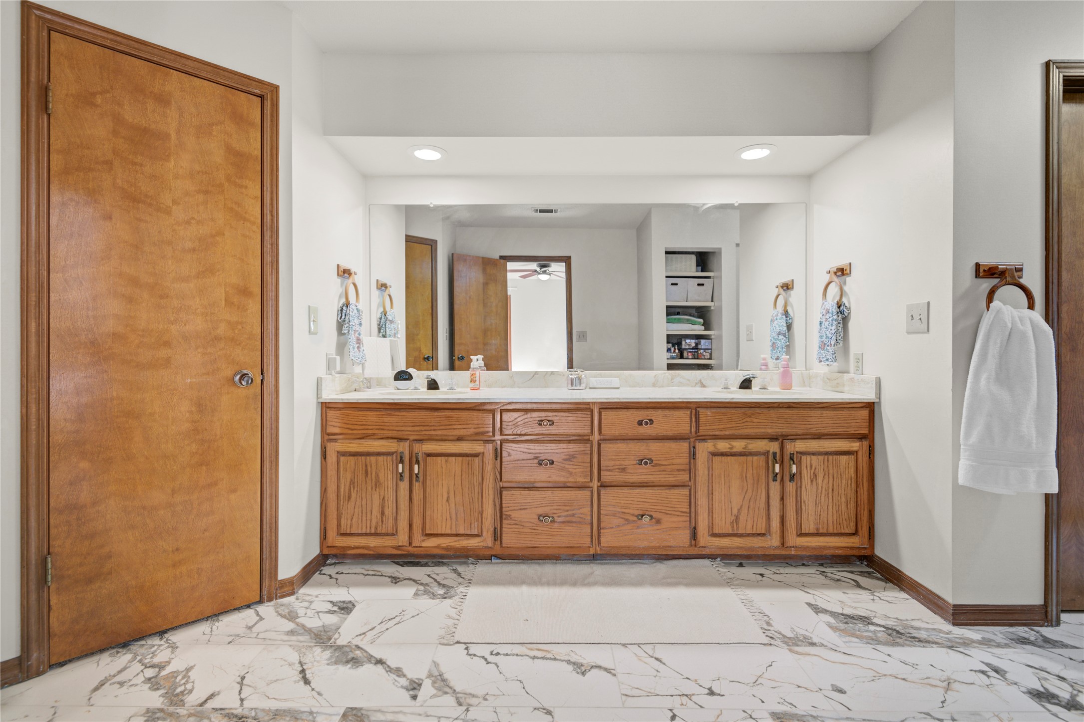 6711 River Lodge Drive Spring, TX 77379 - Photo 21 of 39 a spacious bathroom with a granite countertop sink and a mirror