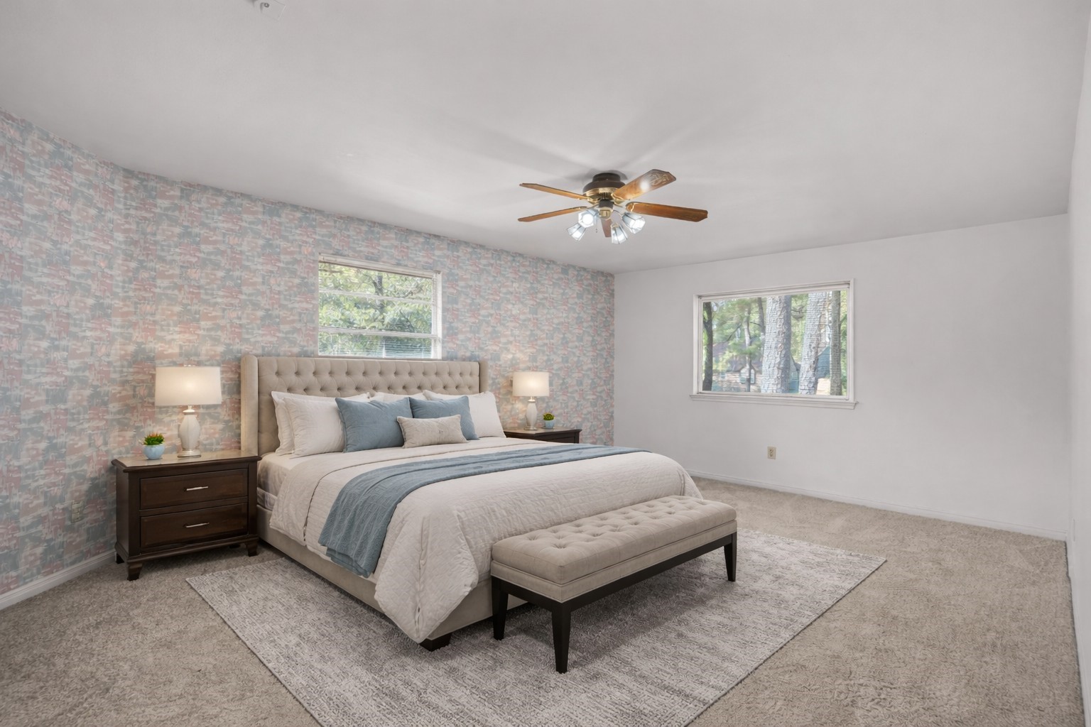 6711 River Lodge Drive Spring, TX 77379 - Photo 22 of 39 a spacious bedroom with a bed and a chandelier