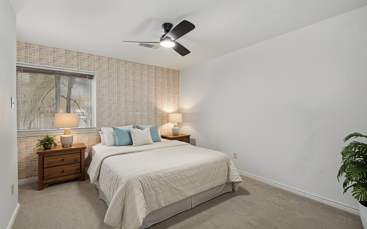 6711 River Lodge Drive Spring, TX 77379 - Photo 26 of 39 a bedroom with a bed and a potted plant