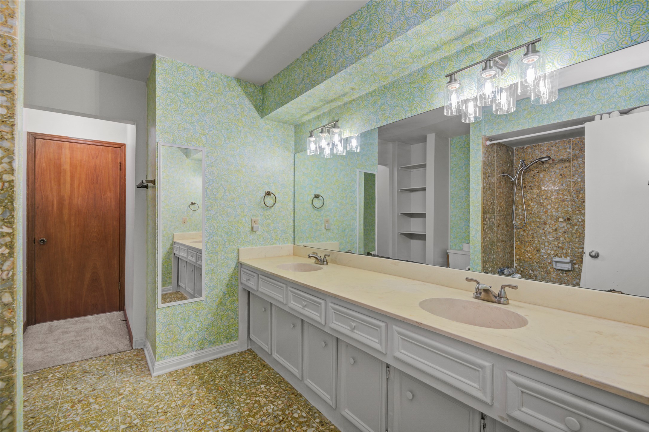 6711 River Lodge Drive Spring, TX 77379 - Photo 29 of 39 a spacious bathroom with a sink a large mirror and a shower