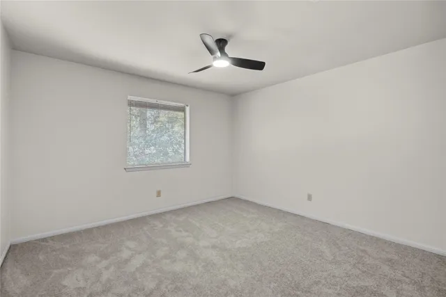 a view of an empty room with windows