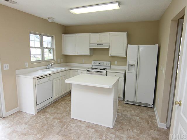 4109 Viewmont Drive Raleigh, NC 27610 - Photo 5 of 12 You'll love this funtional kitchen that boasts an island for serving, cooking or pull up a couple of stools and have lunch for 2! The refrigerator conveys and yes, the kitchen floor is newly installed.