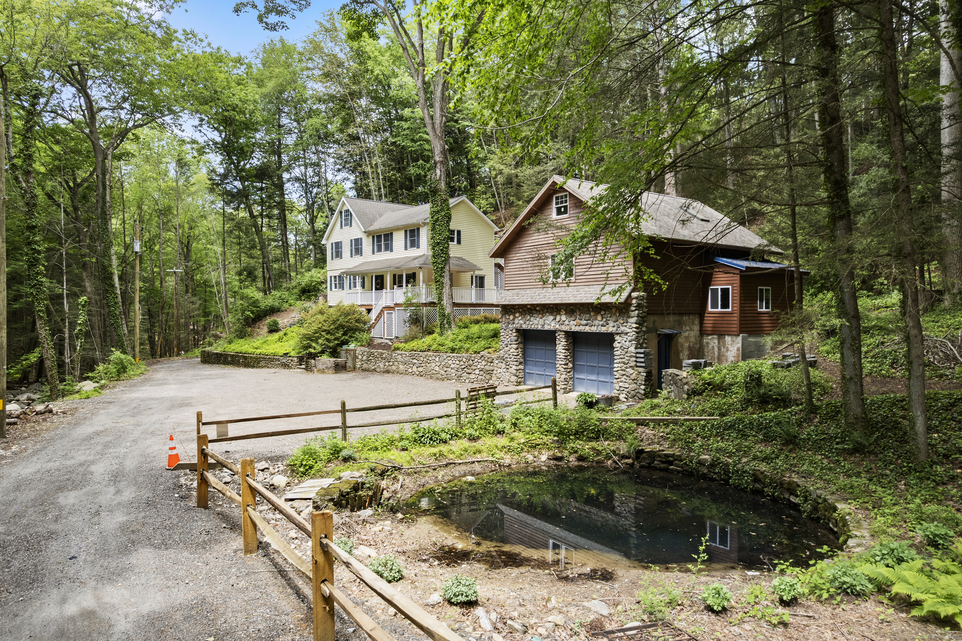 18 Brookside Trail Monroe, CT 06468 - Photo 1 of 1 a front view of a house with a garden