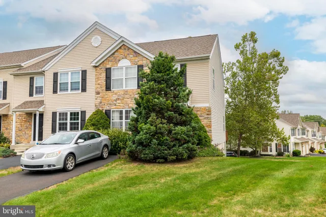 a view of a car parked in front of a house