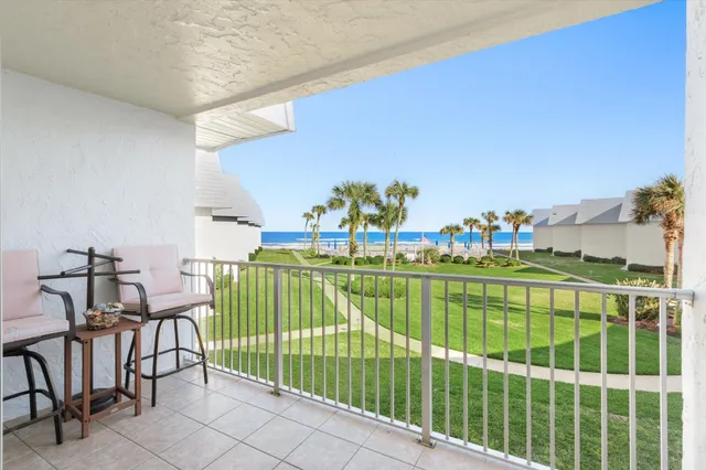 a view of a hallway with furniture and entryway