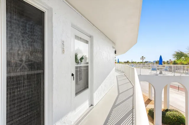 a kitchen with sink a stove and cabinets