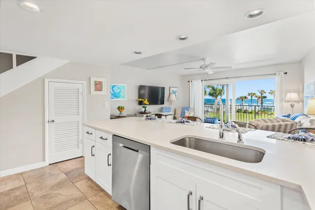 a kitchen with cabinets stainless steel appliances and a counter top space