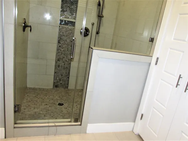 a white toilet sitting next to a small sink