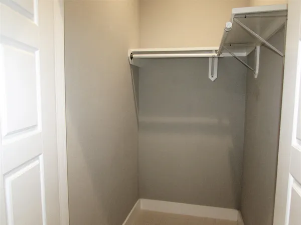 a white toilet sitting next to a shower curtain