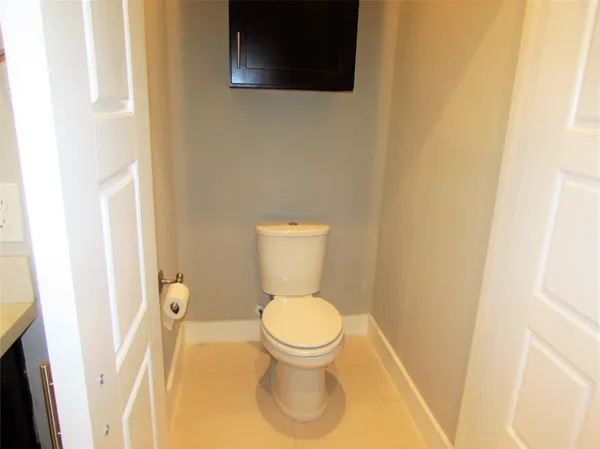 an empty room with ceiling fan