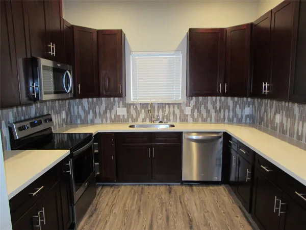 a kitchen with a sink and cabinets