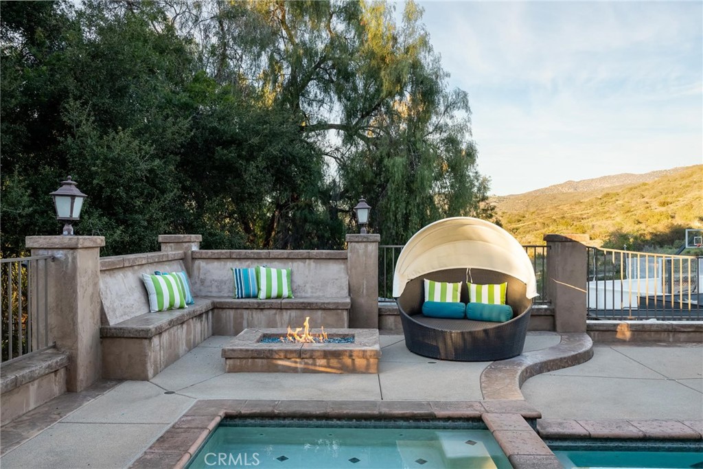 14026 Donart Drive Poway, CA 92064 - Photo 12 of 14 a view of a deck with couches table and chairs and potted plants
