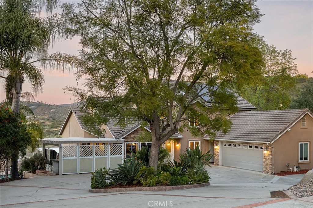 14026 Donart Drive Poway, CA 92064 - Photo 2 of 14 a front view of a house with a tree