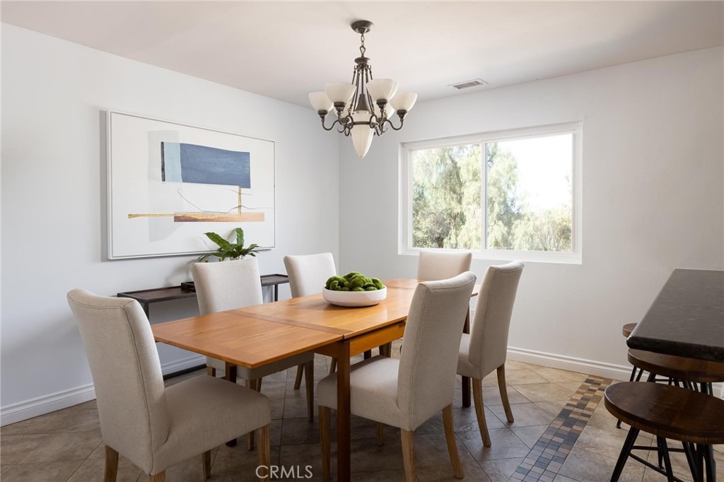 14026 Donart Drive Poway, CA 92064 - Photo 4 of 14 a view of a dining room with furniture window and wooden floor