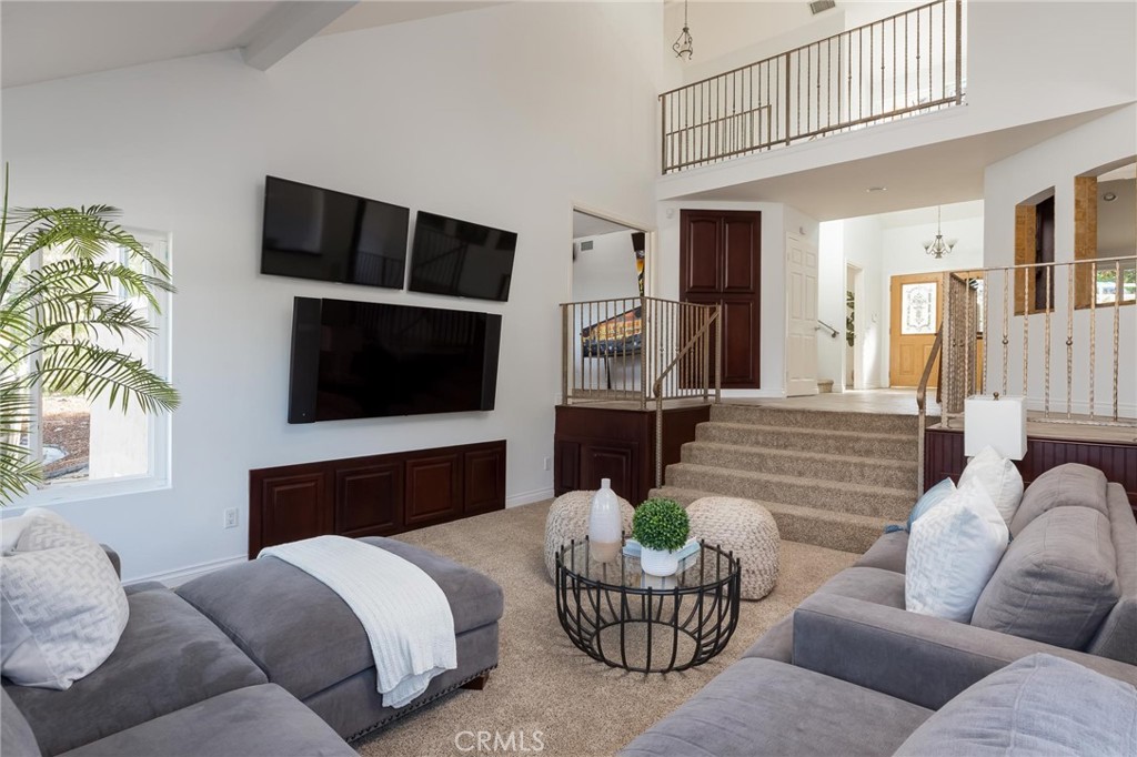 14026 Donart Drive Poway, CA 92064 - Photo 5 of 14 a living room with furniture and a flat screen tv