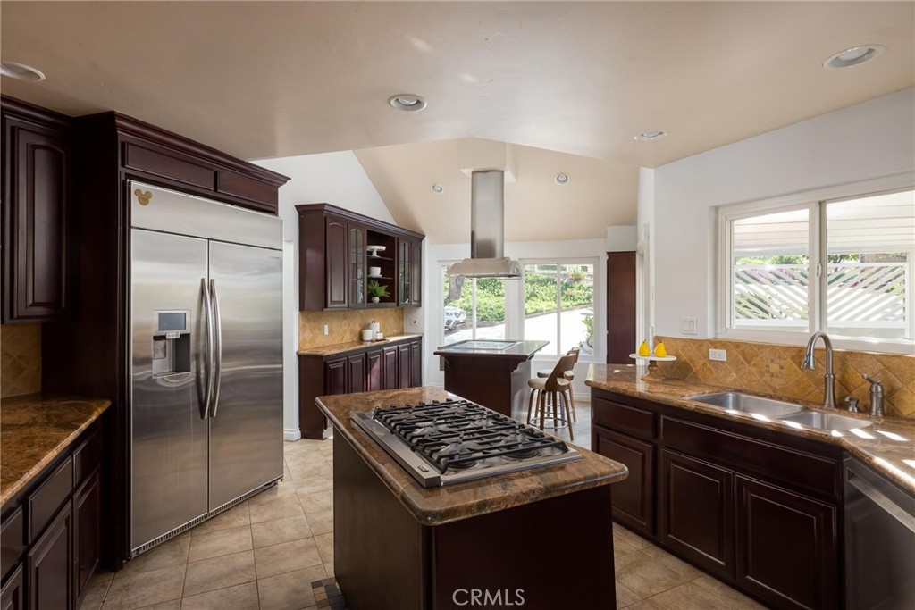 14026 Donart Drive Poway, CA 92064 - Photo 9 of 14 a kitchen with stainless steel appliances granite countertop a stove a refrigerator and a sink