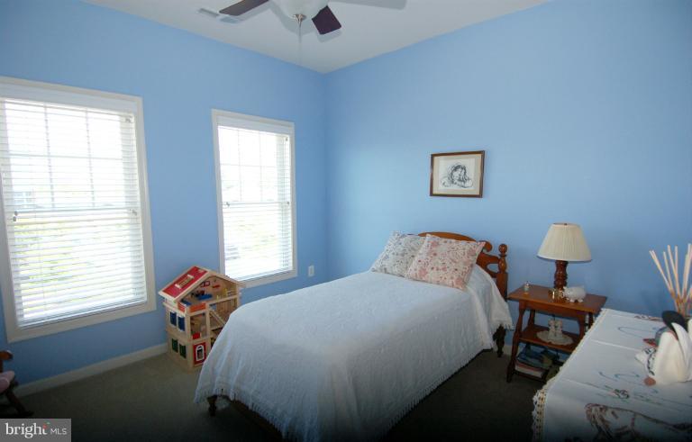 1309 Rome Court Odenton, MD 21113 - Photo 15 of 30 a bed sitting in a bedroom next to a window