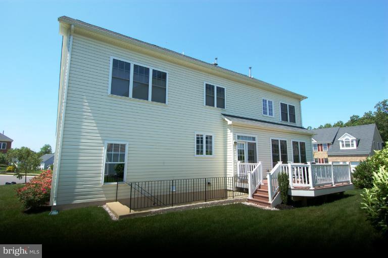 1309 Rome Court Odenton, MD 21113 - Photo 17 of 30 a front view of a house with a yard and porch