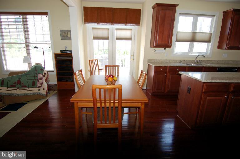 1309 Rome Court Odenton, MD 21113 - Photo 19 of 30 a view of a dining room with furniture window and wooden floor
