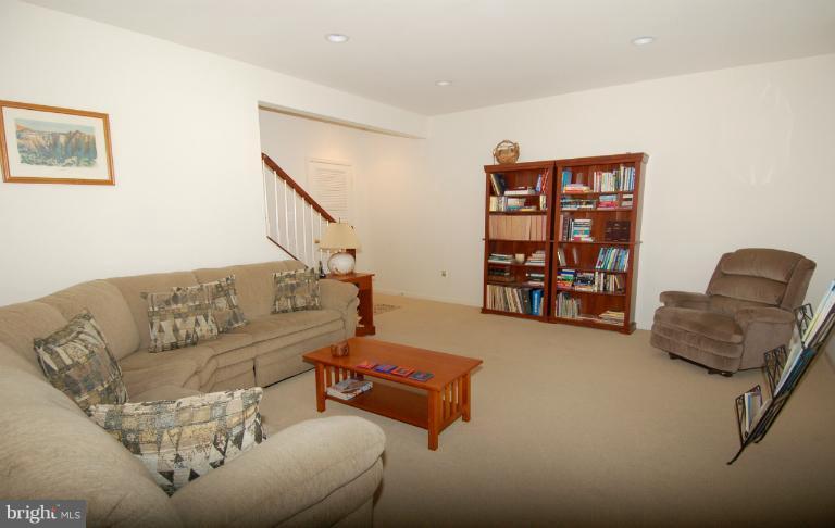 1309 Rome Court Odenton, MD 21113 - Photo 21 of 30 a living room with furniture and stairs
