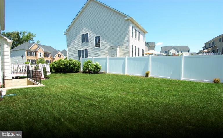 1309 Rome Court Odenton, MD 21113 - Photo 22 of 30 a front view of a house with a yard