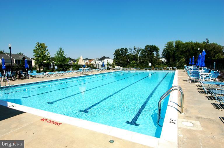 1309 Rome Court Odenton, MD 21113 - Photo 29 of 30 a view of a tennis ground with large trees