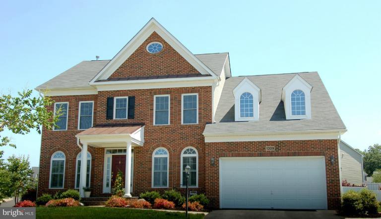 1309 Rome Court Odenton, MD 21113 - Photo 30 of 30 a front view of a house with a yard