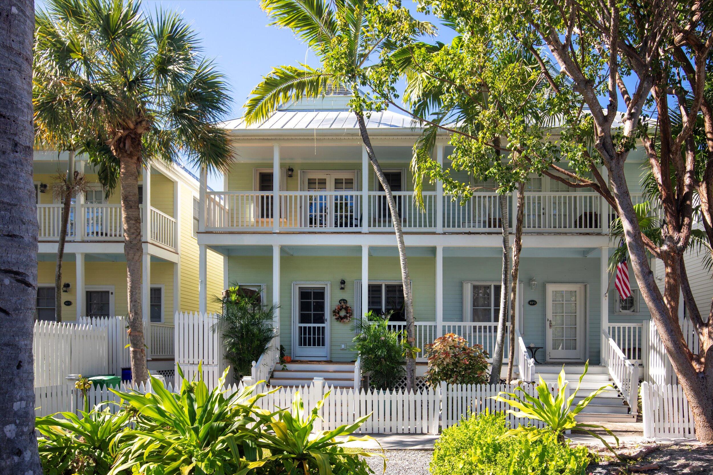 front view of a house with potted plants