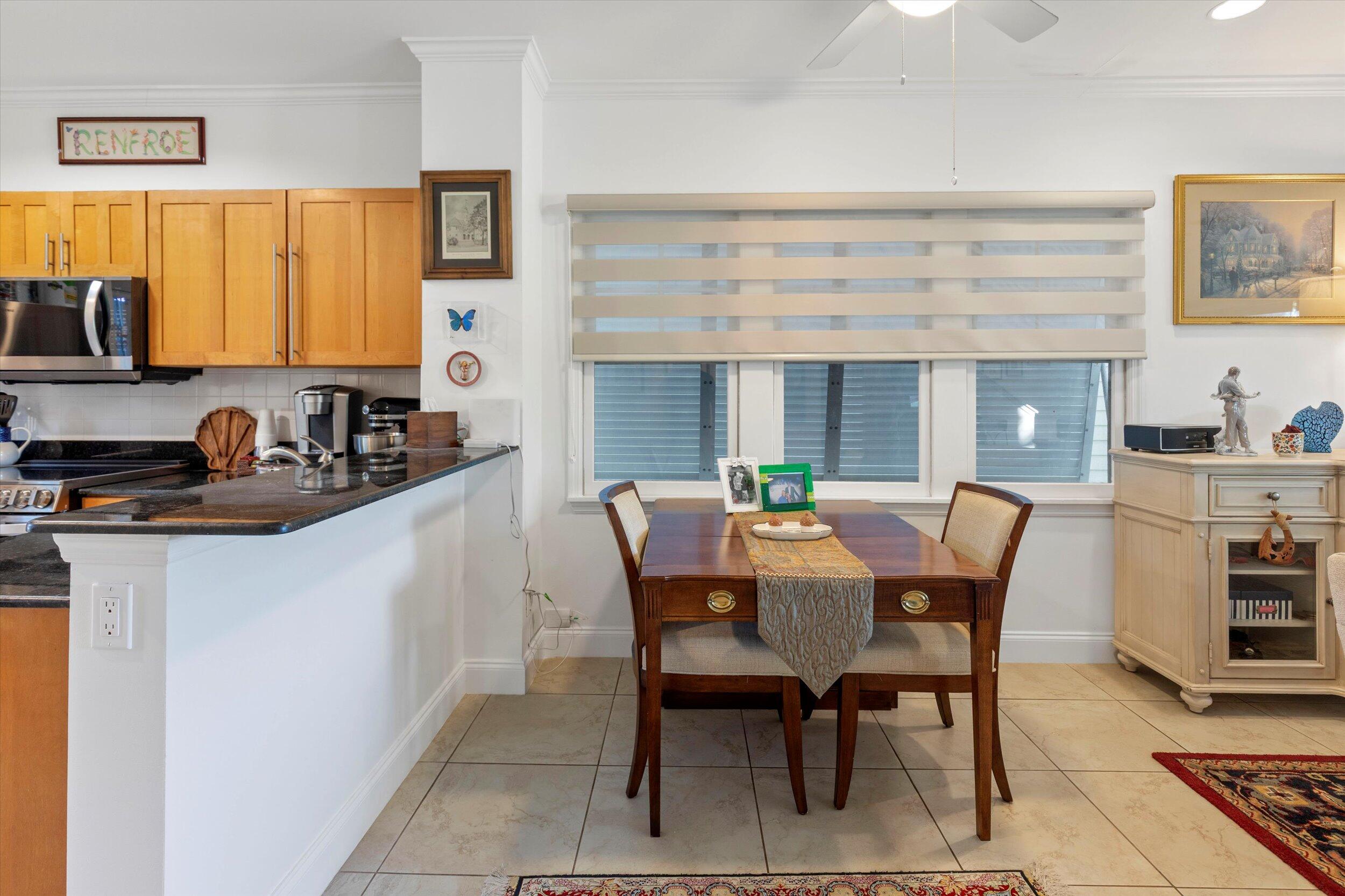 44 Spoonbill Way, Unit 1 Key West, FL 33040 - Photo 16 of 83 a dining room with furniture and window