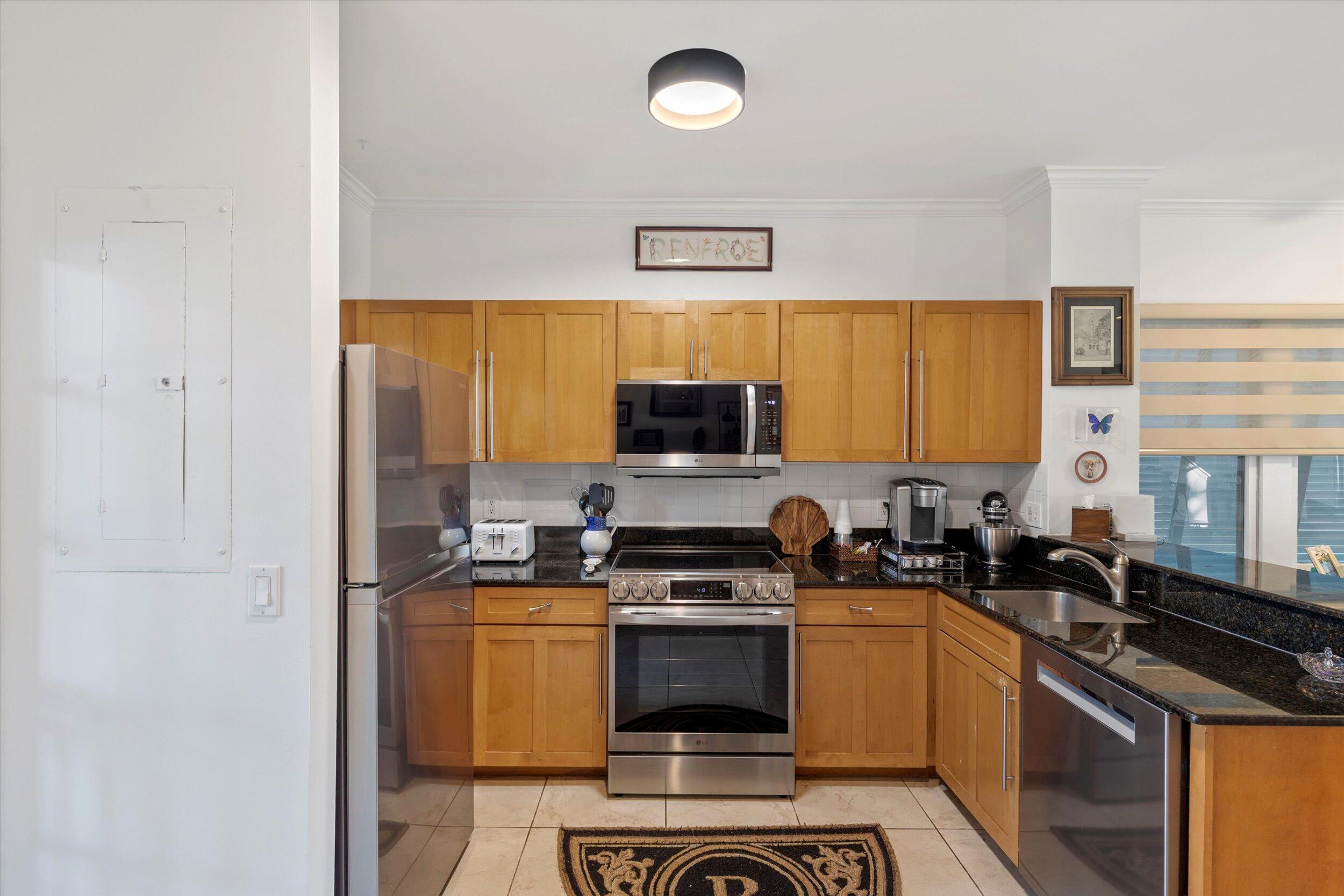 44 Spoonbill Way, Unit 1 Key West, FL 33040 - Photo 18 of 83 a kitchen with a sink stove and microwave