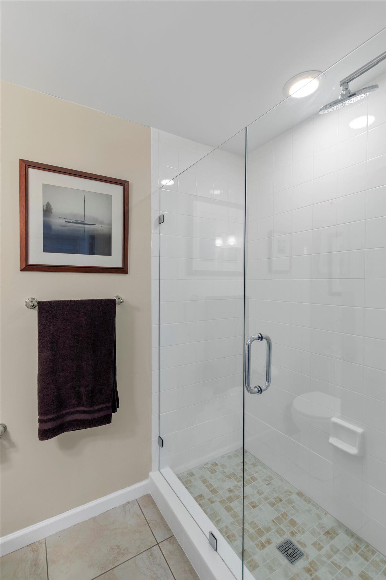 44 Spoonbill Way, Unit 1 Key West, FL 33040 - Photo 20 of 83 a bathroom with a shower and mirror