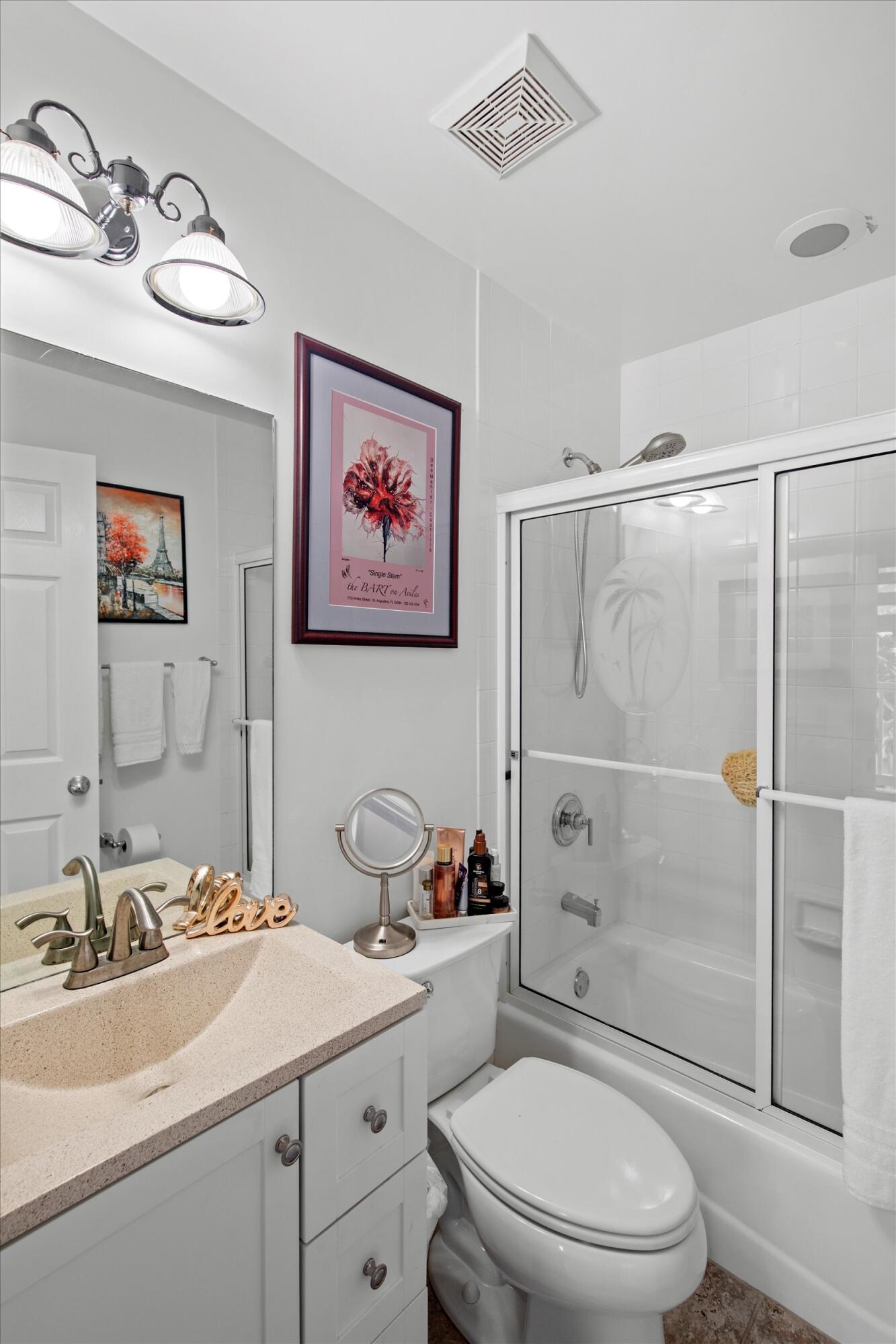 44 Spoonbill Way, Unit 1 Key West, FL 33040 - Photo 30 of 83 a bathroom with a sink toilet and shower