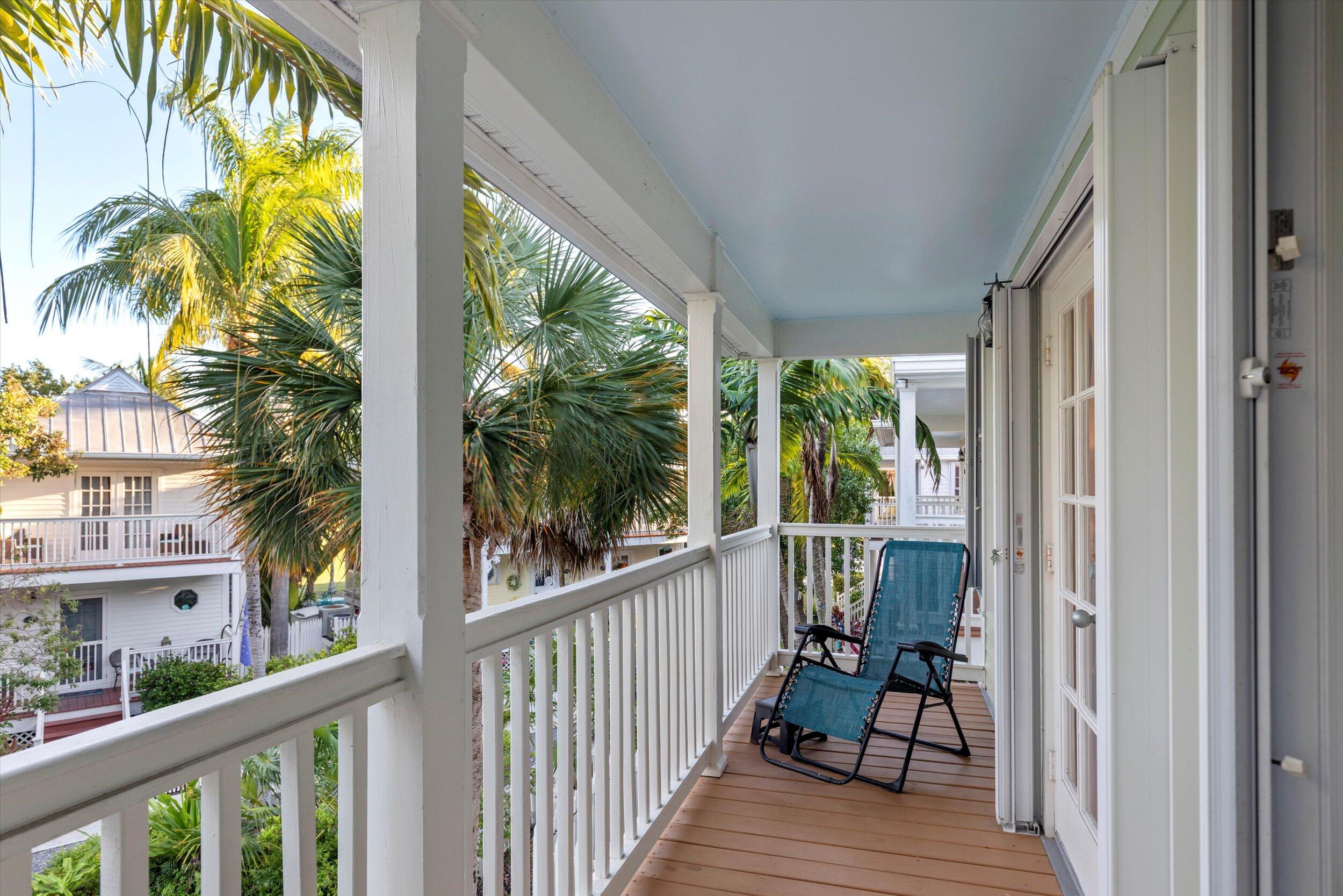 44 Spoonbill Way, Unit 1 Key West, FL 33040 - Photo 34 of 83 a view of a balcony with chairs
