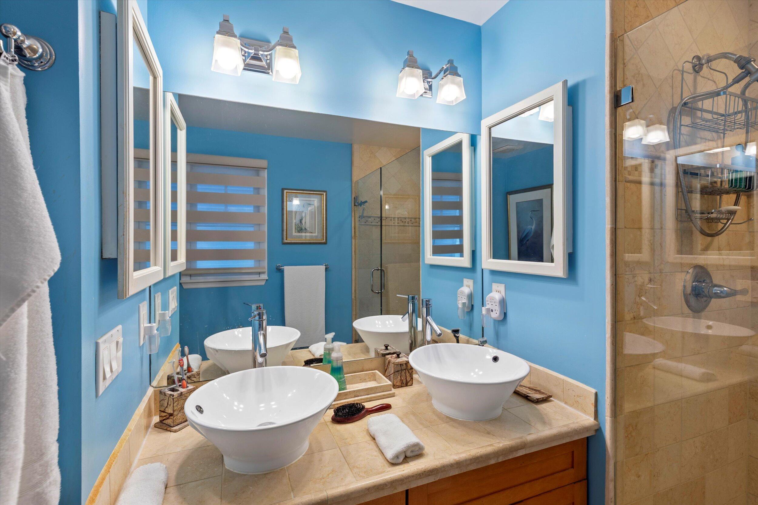 44 Spoonbill Way, Unit 1 Key West, FL 33040 - Photo 36 of 83 a bathroom with a granite countertop sink and a mirror