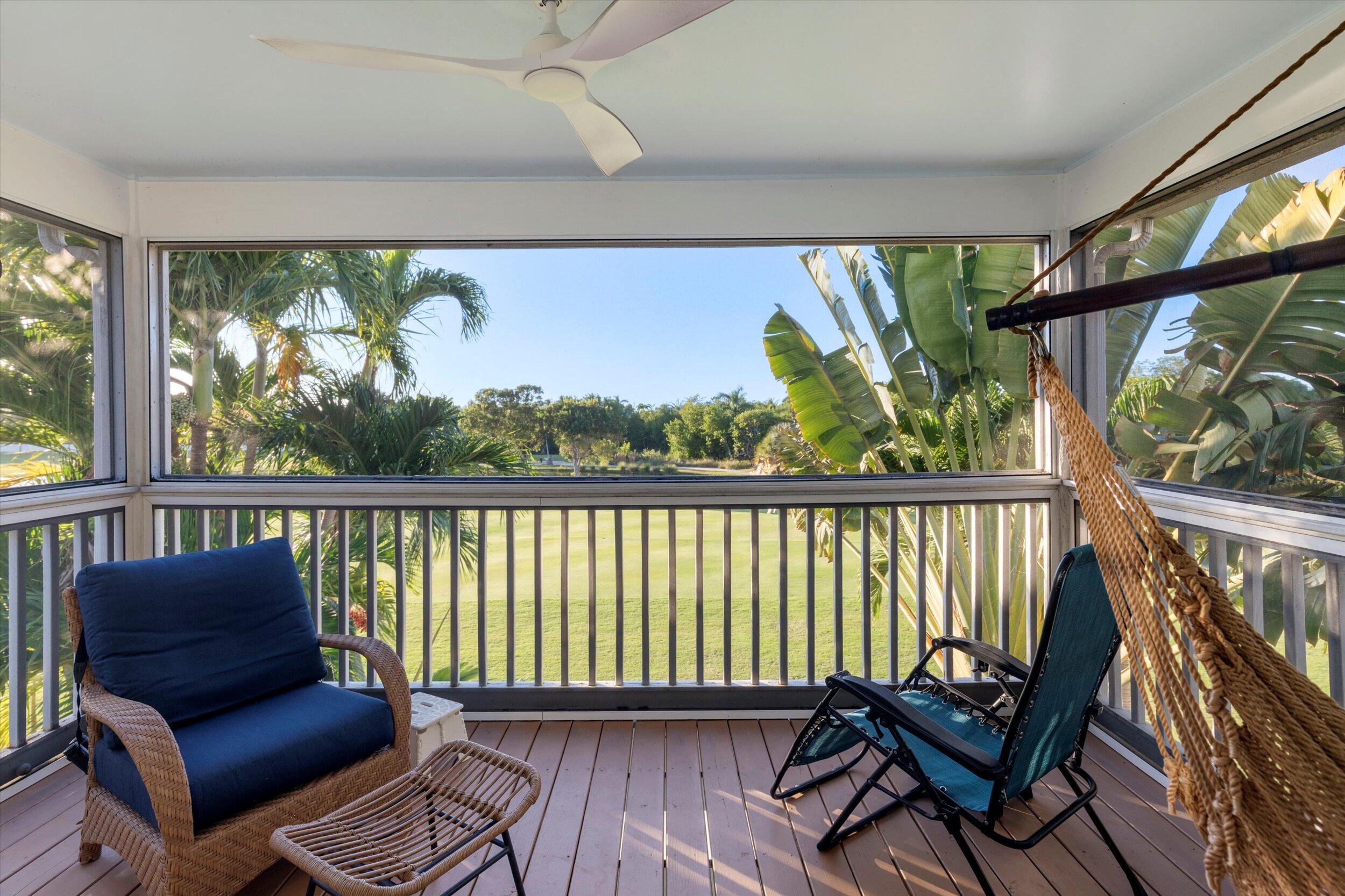 44 Spoonbill Way, Unit 1 Key West, FL 33040 - Photo 37 of 83 a balcony with wooden floor outdoor seating and furniture