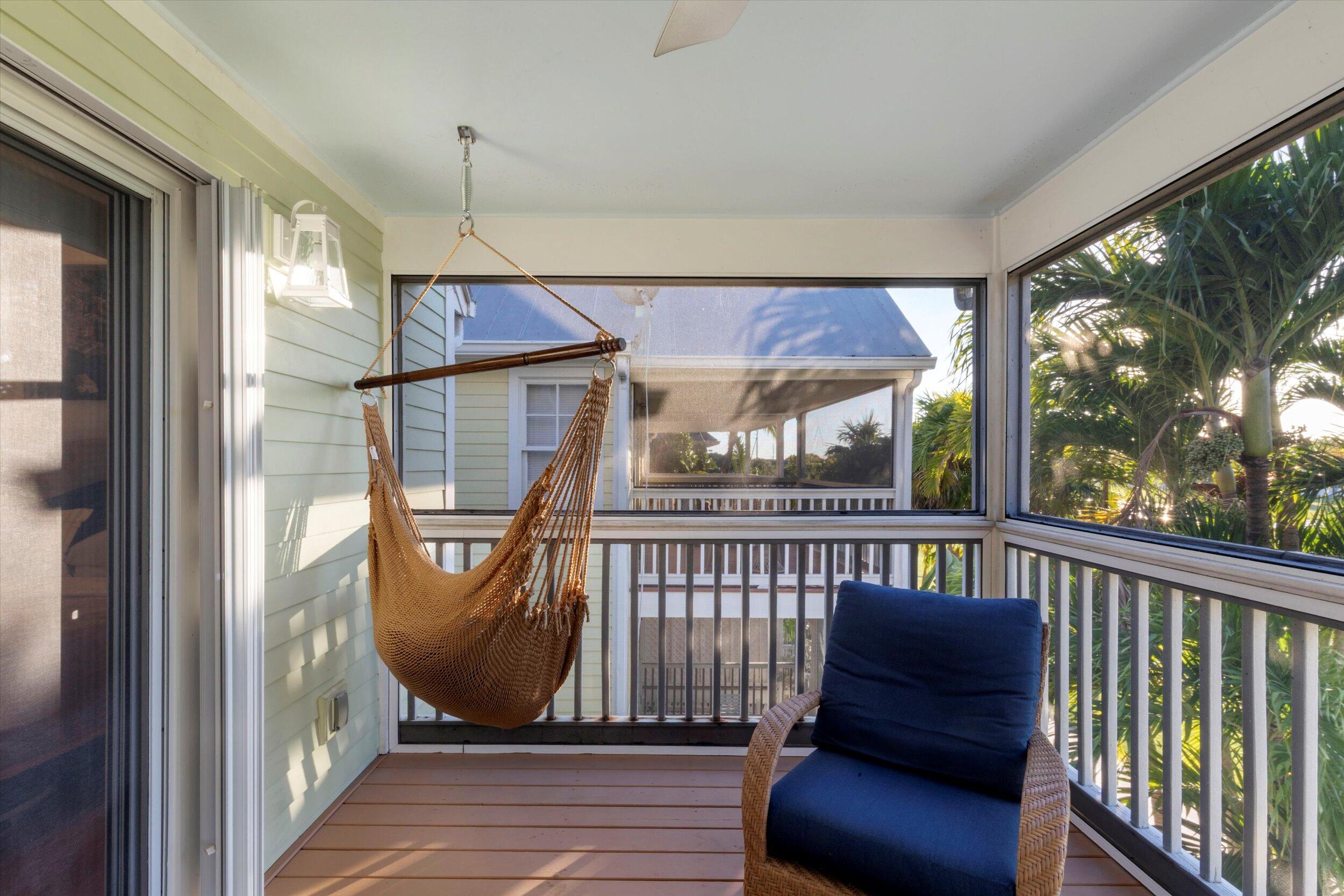 44 Spoonbill Way, Unit 1 Key West, FL 33040 - Photo 40 of 83 a view of a porch with furniture
