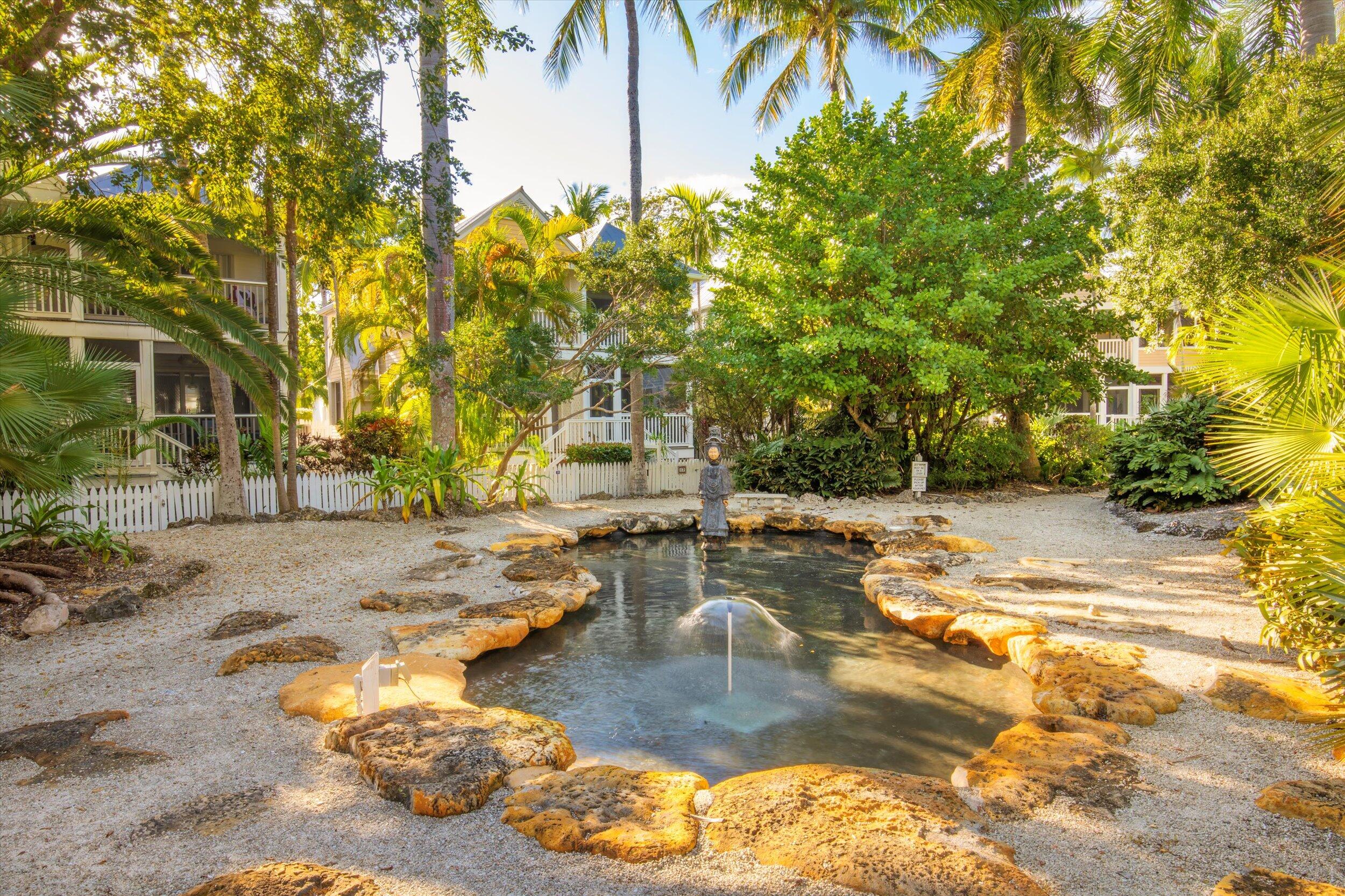 44 Spoonbill Way, Unit 1 Key West, FL 33040 - Photo 55 of 83 a view of a swimming pool with a patio